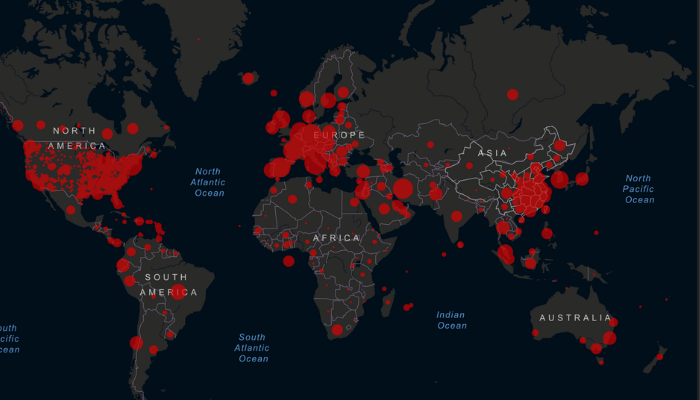 A world map showing spread of COVID 19 in different countries as red dots.